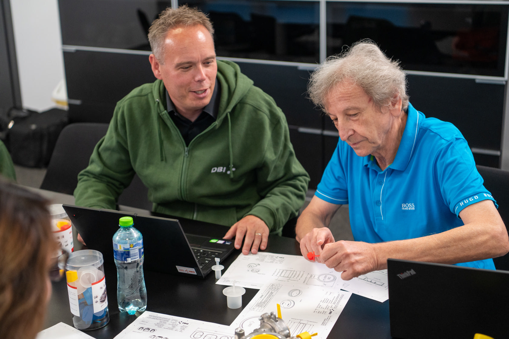 DBI Plastics engineers collaborating with clients on technical solutions.